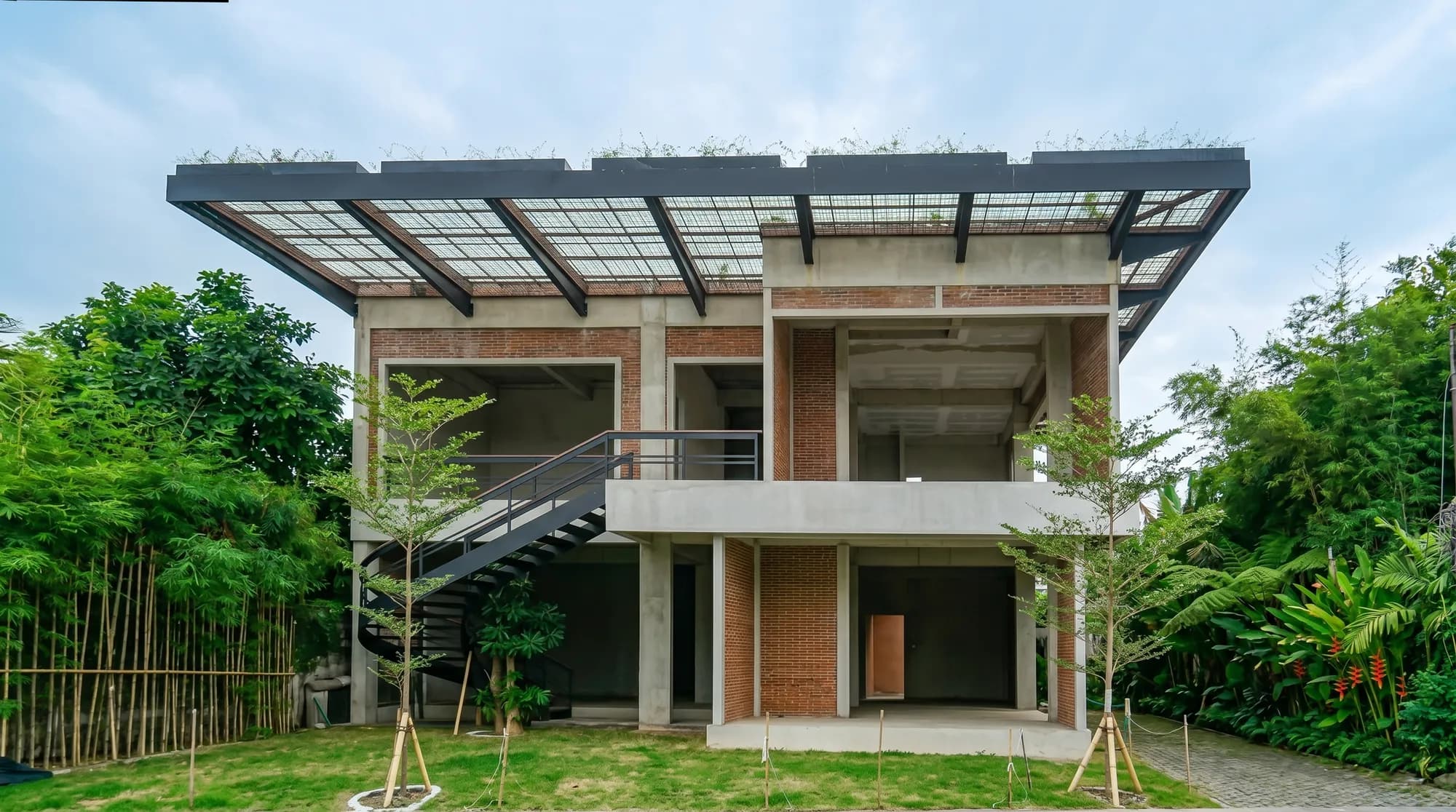 BERAWA 1053 finished space — The finished exterior — bold brick, glass, and steel facing the street.
